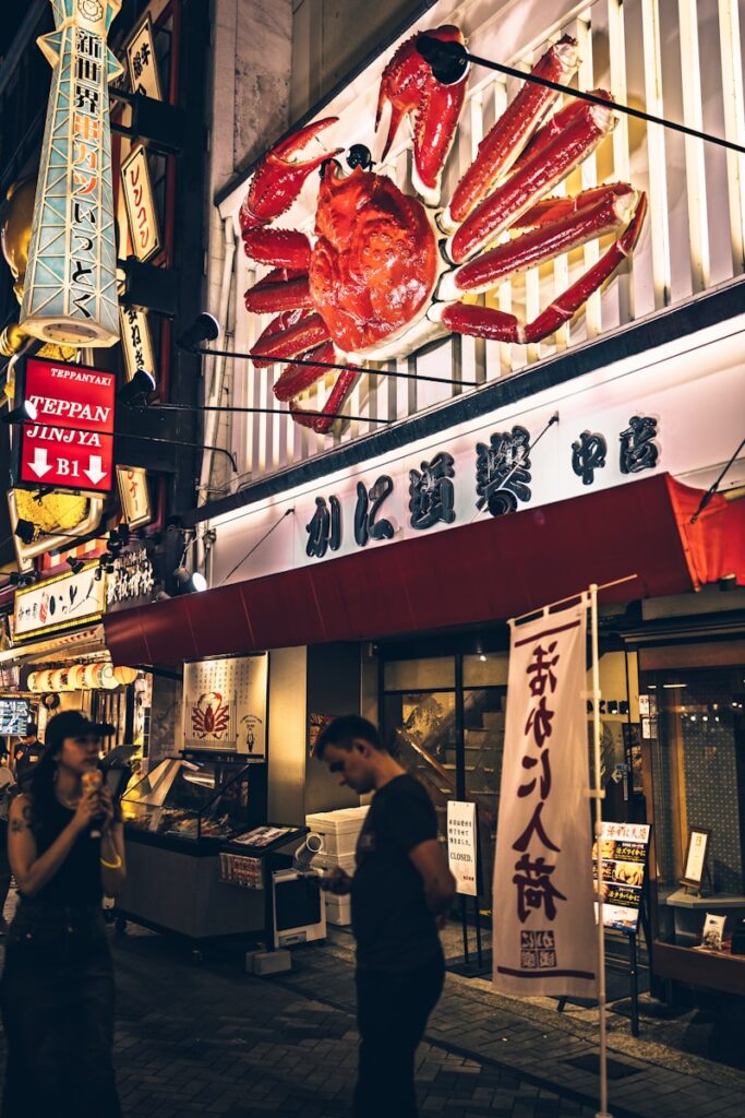 Giant crab sign above a japanese restaurant at night