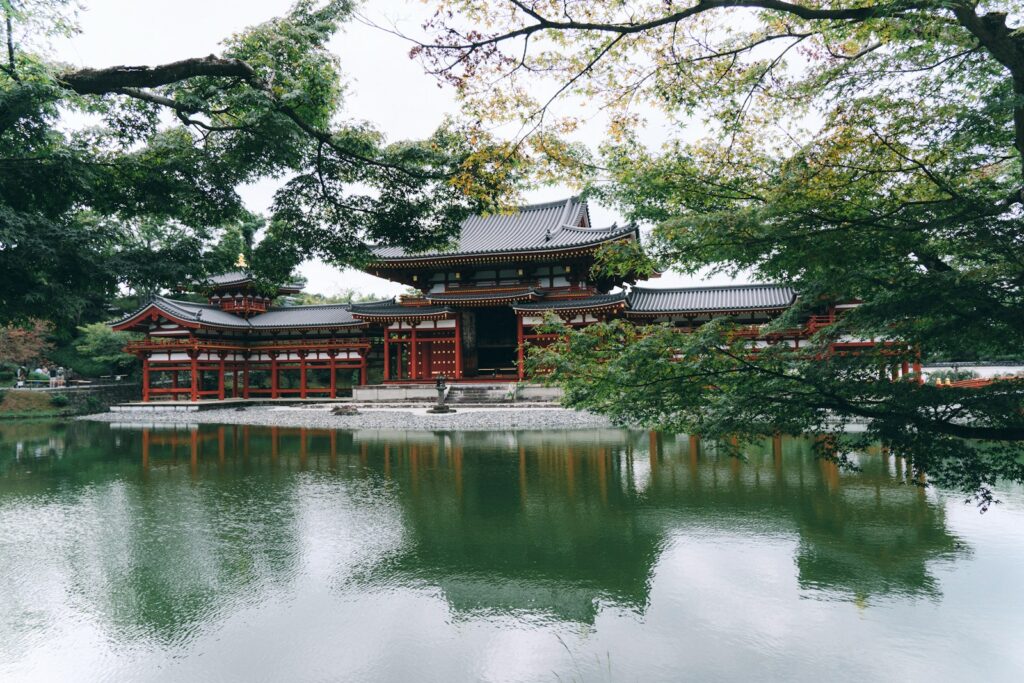 Japanese temple reflected in a calm pond