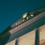 a rolex store sign on the side of a building