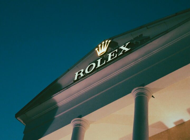 a rolex store sign on the side of a building